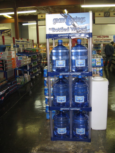 Grand Springs water bottles using Prostack water storage rack in a grocery store