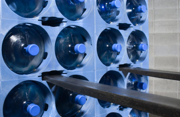 Front view of a blue 5 gallon water bottle storage rack by Prostack